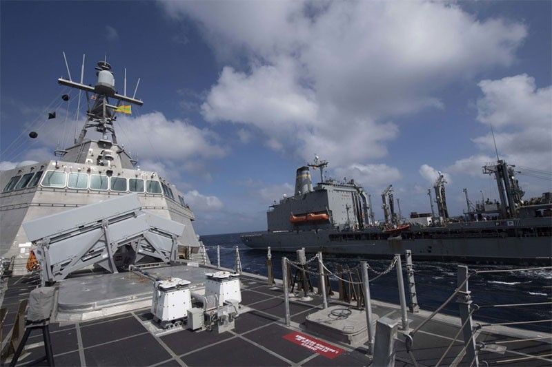 China condemns US navy sail-by in disputed waters