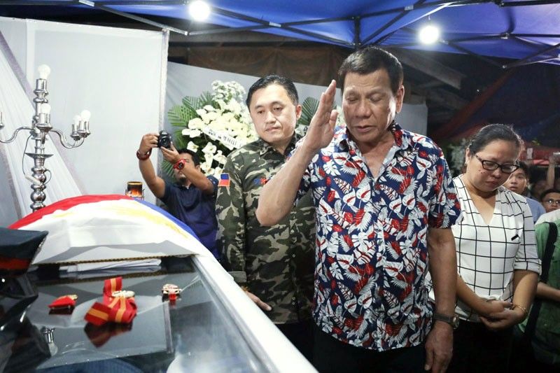 Duterte honors cop killed in school explosion