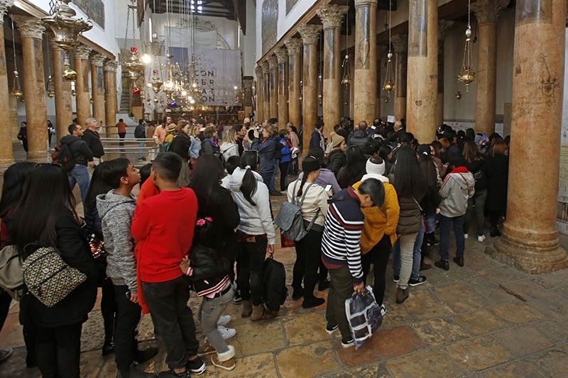 At Christmas, Bethlehem says denied full gifts of tourism