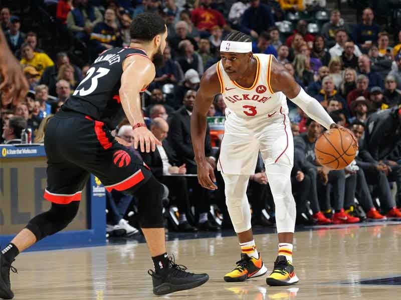 Holiday shines as Pacers edge Raptors in OT