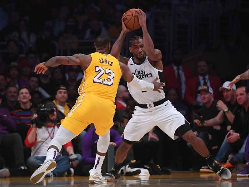Leonard leads Clippers over Lakers; 76ers tame Bucks