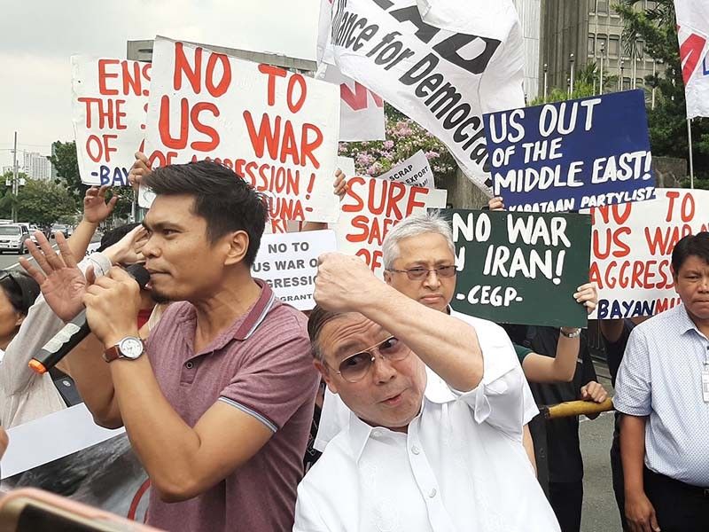 Locsin challenges activists at DFA picket to try to beat him up
