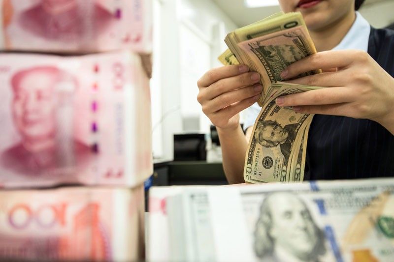 In sign of easing tension, US removes currency manipulator label on China