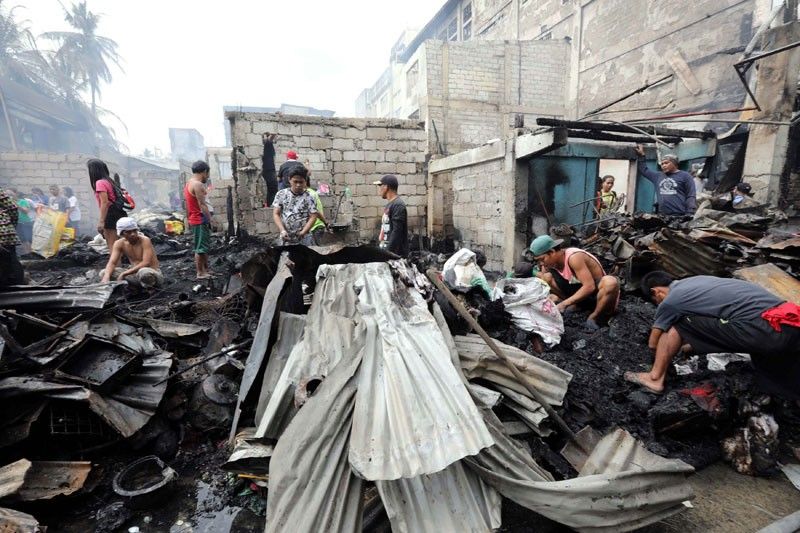 Woman dies, 3 hurt in Quezon City fire