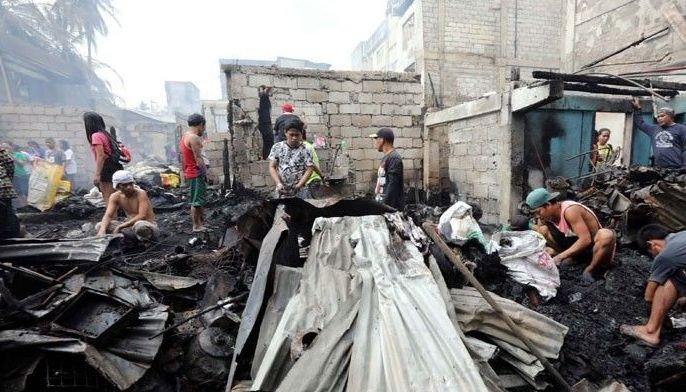 Woman dies, 3 hurt in Quezon City fire