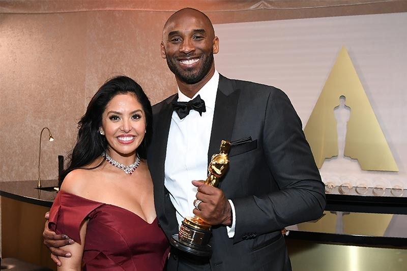 Kobe Bryant dons teal suit out with wife Vanessa in LA