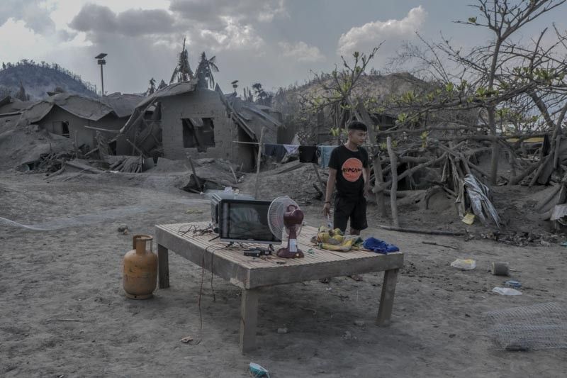 Return to 'no man's land': Residents of 'Pulo' come home weeks after eruption