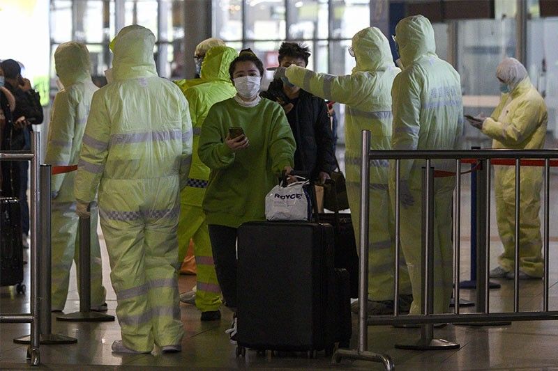 China virus deaths rise past 900, overtaking SARS toll