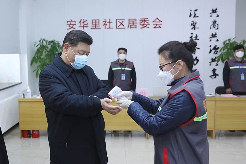 China virus toll passes 1,000 as Xi visits frontline hospital