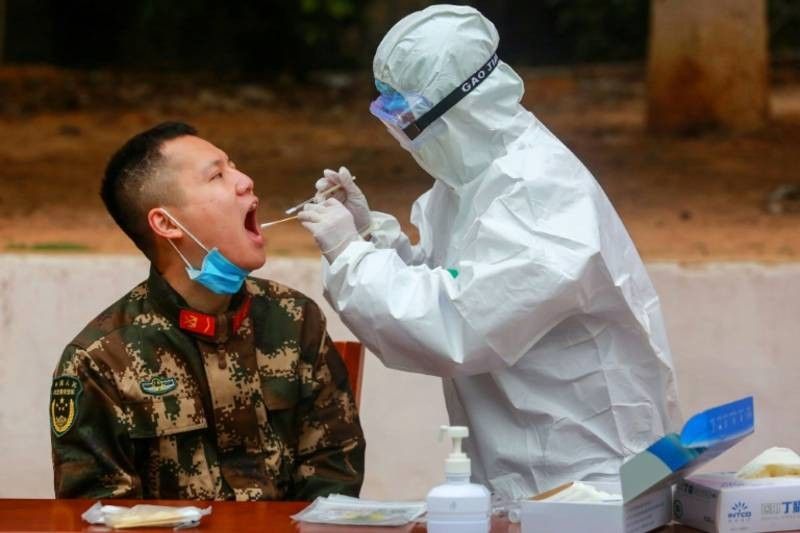 Virus death toll soars as China changes counting methods