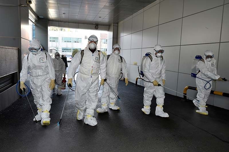 First South Korea virus patient dies as number of infections doubles
