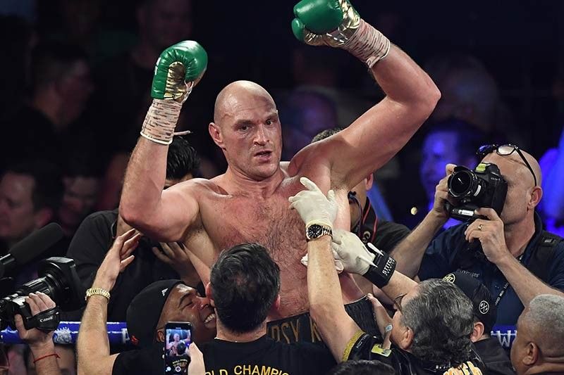 Fury batters Wilder in TKO triumph in WBC heavyweight title rematch