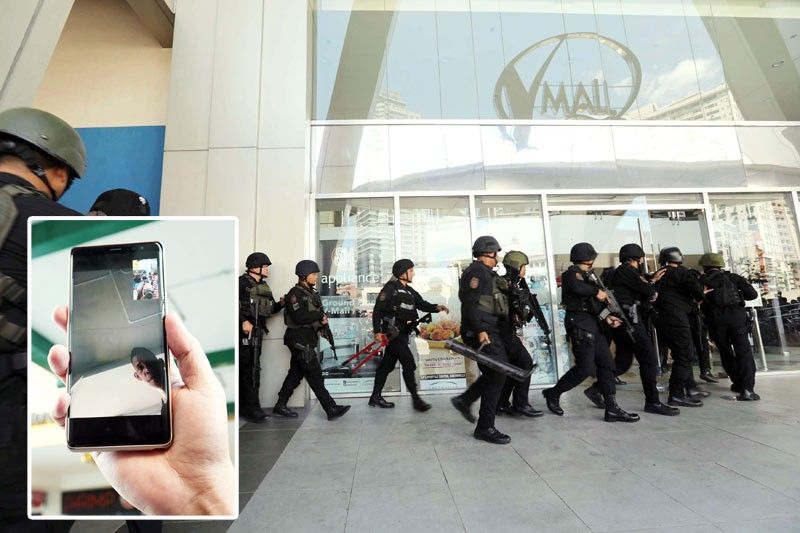 Sacked mall guard holds dozens hostage; 1 hurt