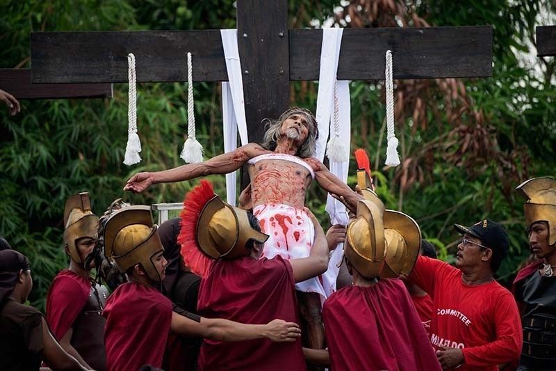 Virus-hit Philippines calls off ritual crucifixions