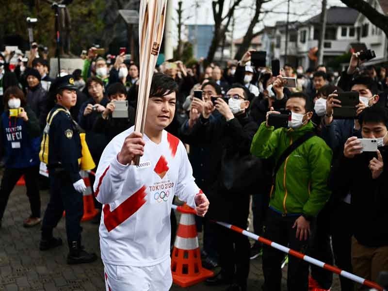 Tokyo Olympics flame festivities scaled back over virus