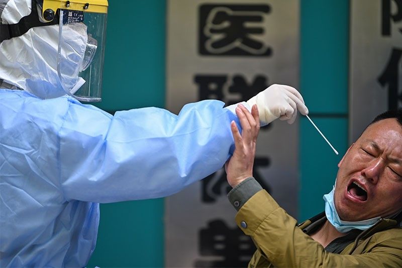 China under mounting pressure over virus origins