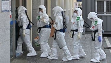 South Korean nurses wearing protective gear arrive for their shift to care for patients infected with the COVID-19 coronavirus at Keimyung University Daegu Dongsan Hospital in Daegu on April 29, 2020. South Korea once had the largest outbreak outside China, where the disease first emerged, but appears to have brought it under control with an extensive "trace, test and treat" programme.