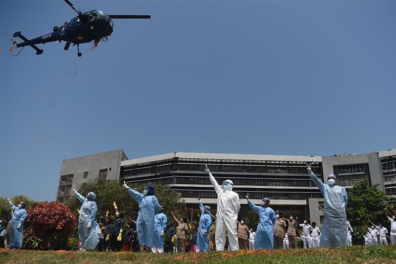 India's military salutes virus workers with rose petals, flypasts