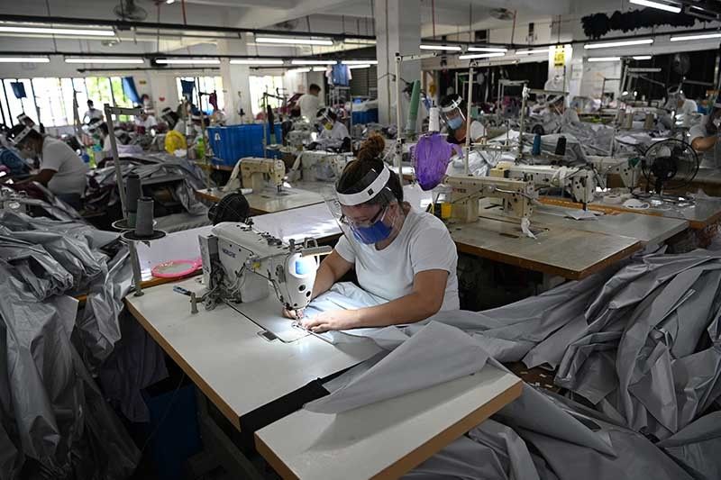 Cautious factories slow decline in output to close 2020