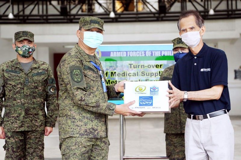 Metrobank turns over PPE donation to AFP, PNP