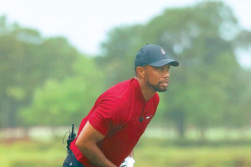 Woods, Manning team up well for charity