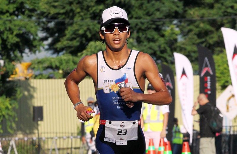 Triathlon king itching to hit road
