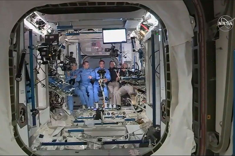 US astronauts enter space station in milestone mission