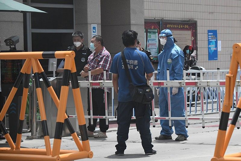 Parts of Beijing locked down as virus outbreak gathers fresh pace