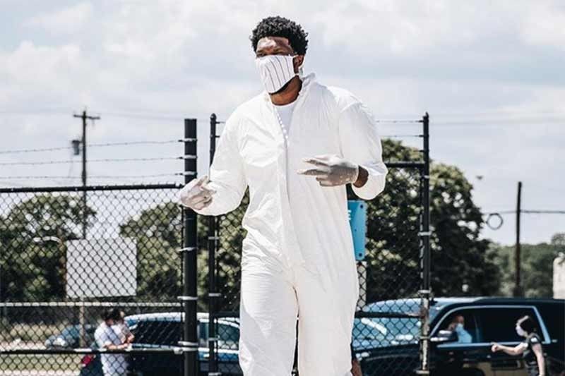 Sixers' Embiid wears Hazmat suit to NBA bubble in Orlando