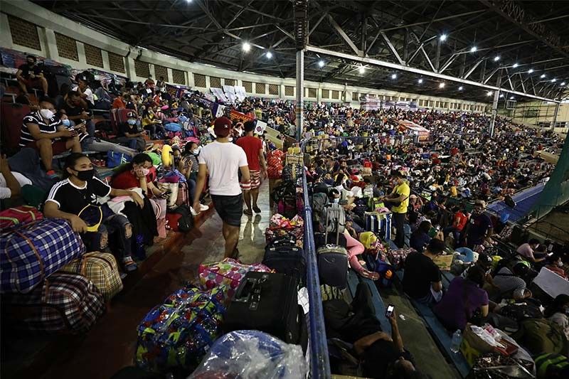 LOOK: Stranded individuals cramped up inside Rizal Memorial Sports Complex