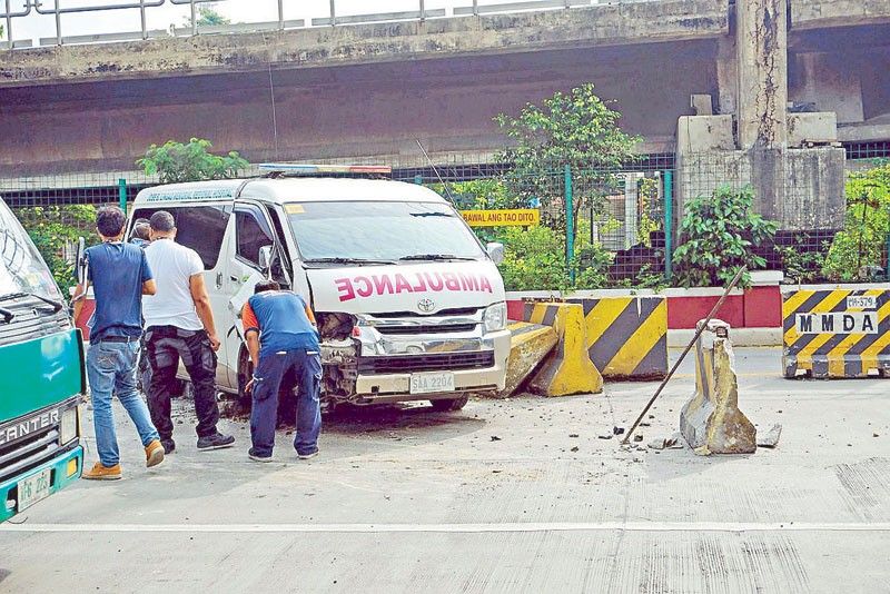 Ambulance hits concrete barriers on EDSA
