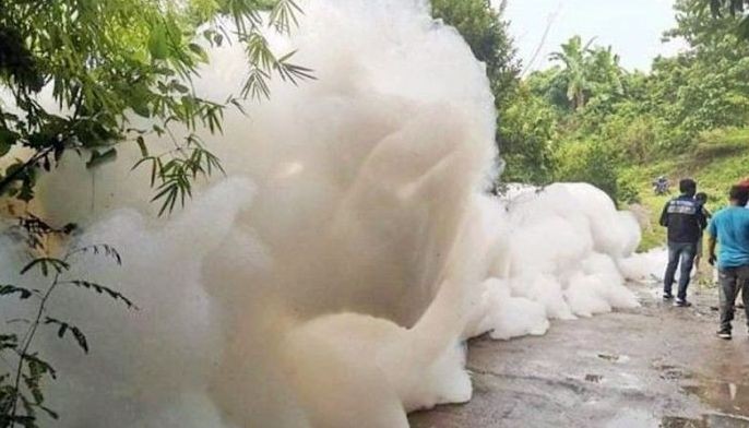 2 held for dumping chemical waste into river