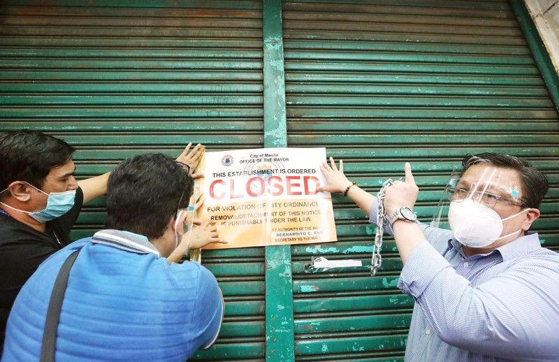 Stalls selling â��Manila, province of Chinaâ�� products padlocked