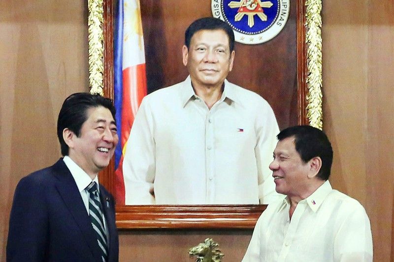 Old friends Duterte, Abe bond during phone call