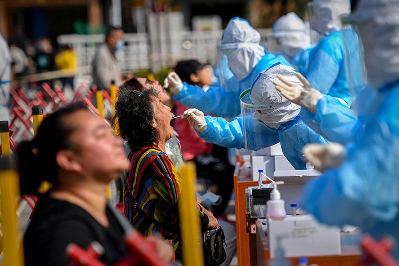 China to test whole city of 9m as Europe rolls out new virus rules