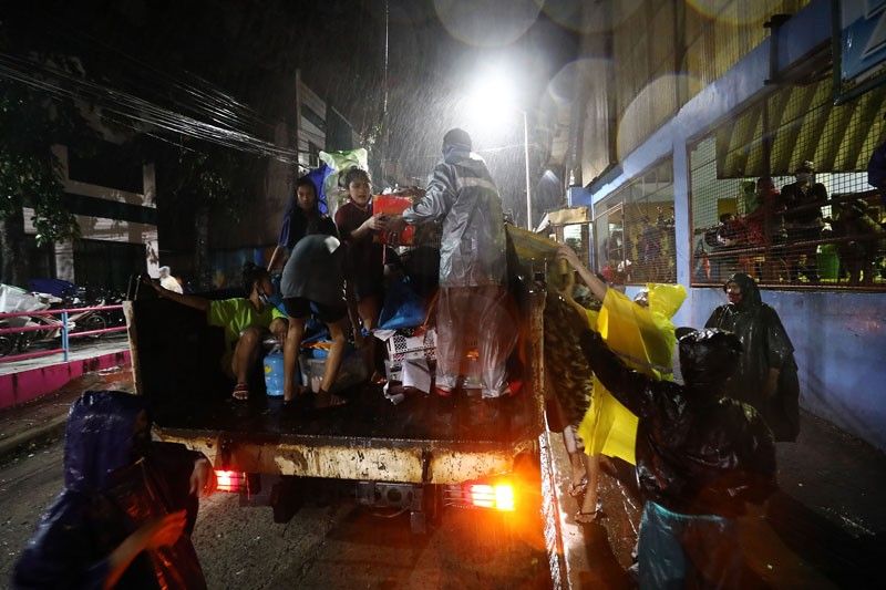 Doctors on boats aid Marikina typhoon victims