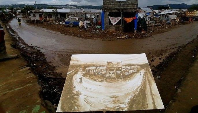 Mud paintings for a cause: Pinoy artists use typhoon-aftermath mud to help typhoon victims