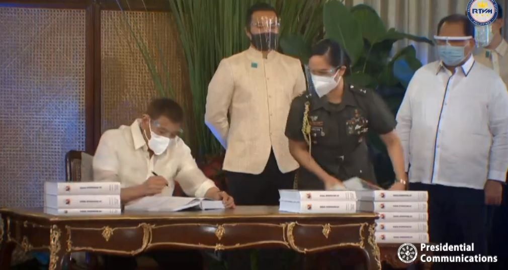 Duterte signs 2021 budget with eyes set on pandemic rebound