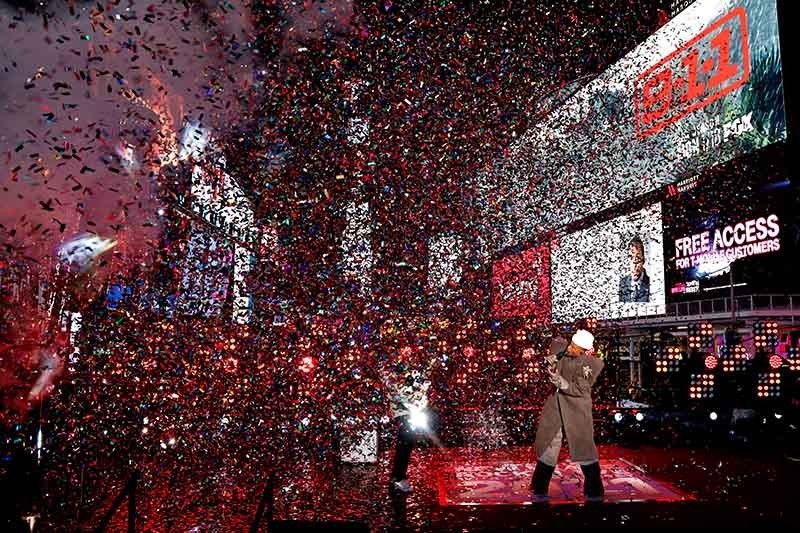 World ushers in New Year under COVID-19 shadow