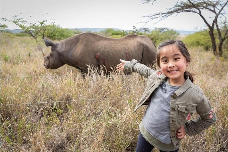 Scarlet Snow adopts baby rhino during Africa trip