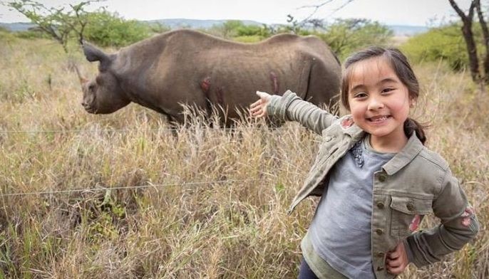 Scarlet Snow adopts baby rhino during Africa trip