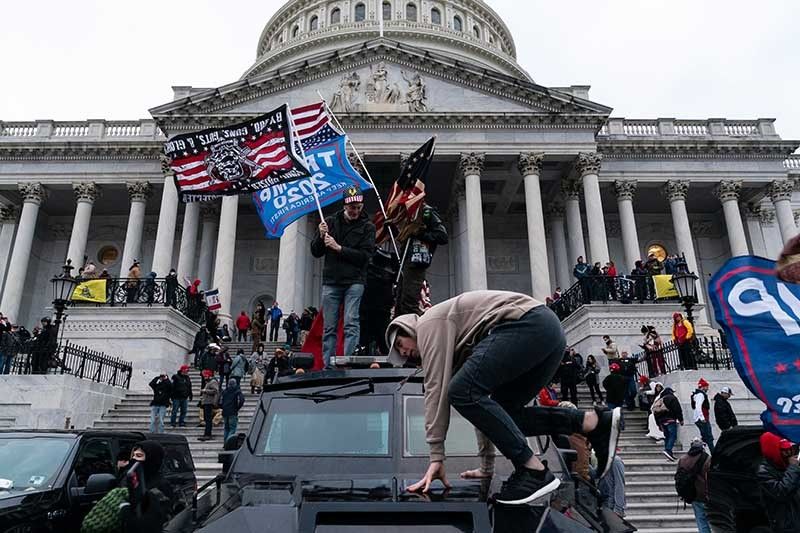A year after Capitol riot, Americans fear for their democracy â�� polls