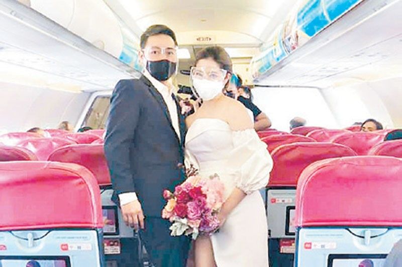 Love is in the air: Couple married on AirAsia flight