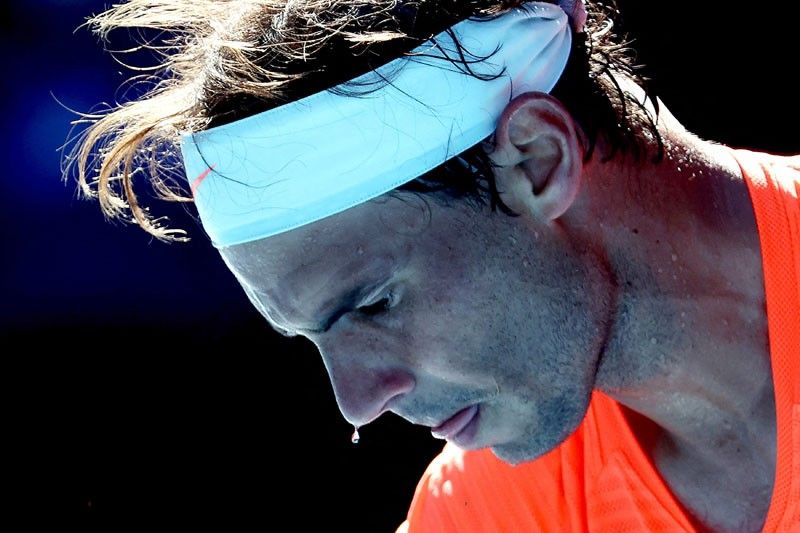 Nadal shakes off back injury; Azarenka ousted