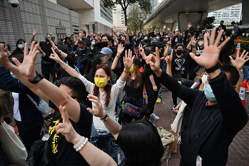 Supporters rally as Hong Kong dissidents charged with subversion