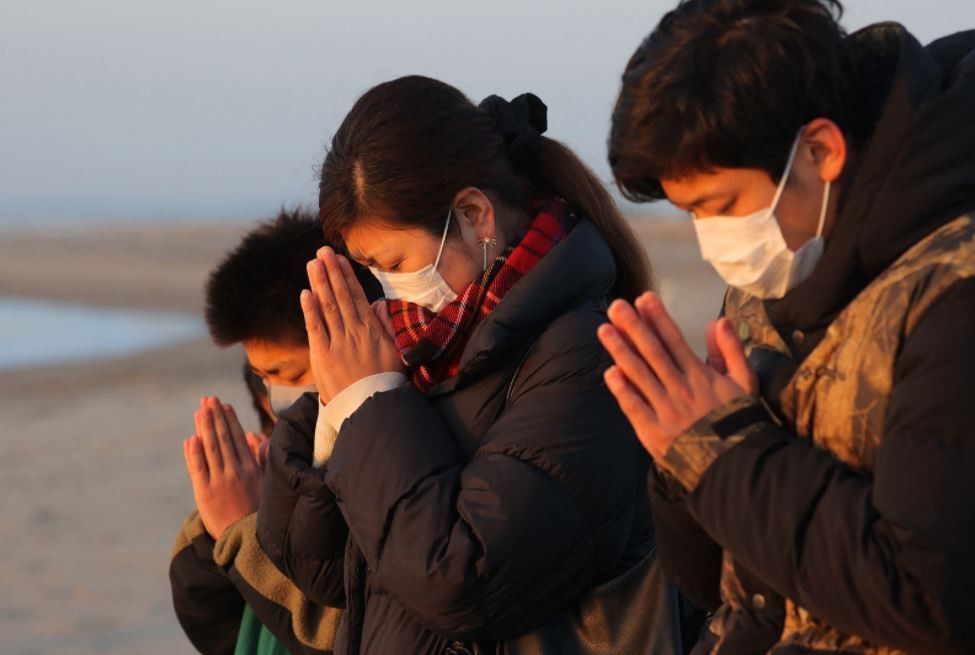 Japan falls silent to mark decade since tsunami disaster