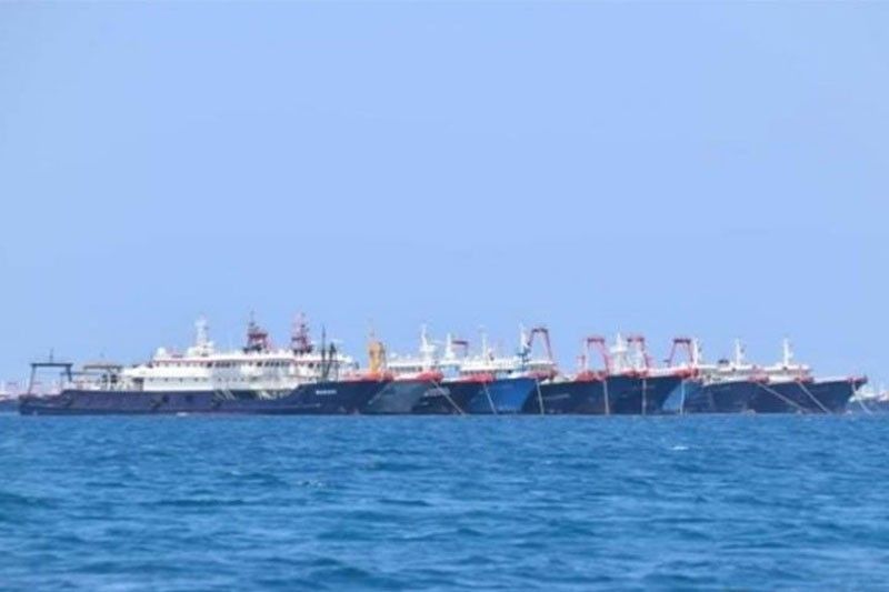 China denies militias, says fishing vessels in its territory