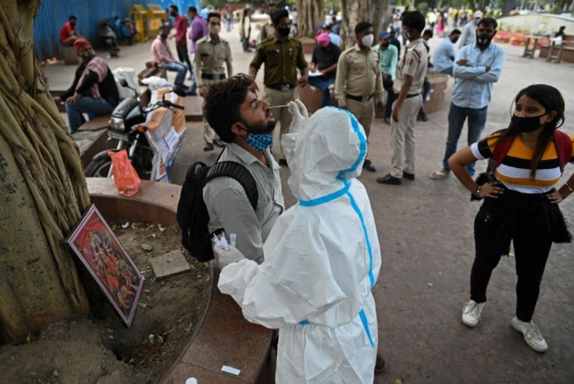 One year from lockdown, India battles sluggish vaccine rollout and new surge