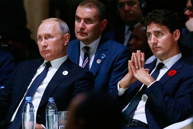 Trudeau says Putin behind 'terrible things,' skirts killer label