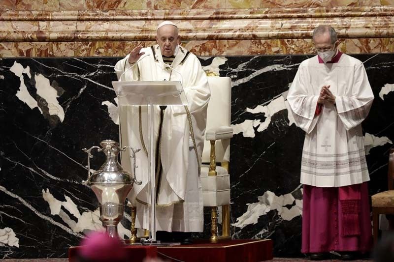 Pope reunites with cardinal he fired in Holy Week mass